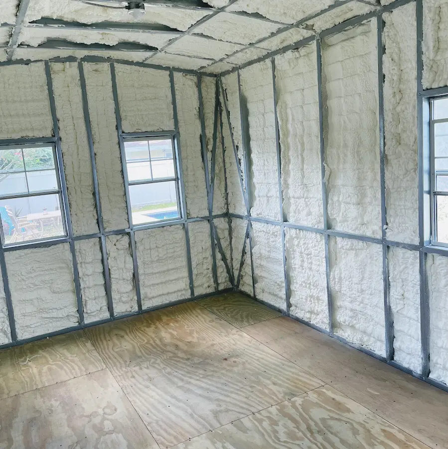 Closed-cell spray foam insulation applied to wall cavities in a residential project in Homeland